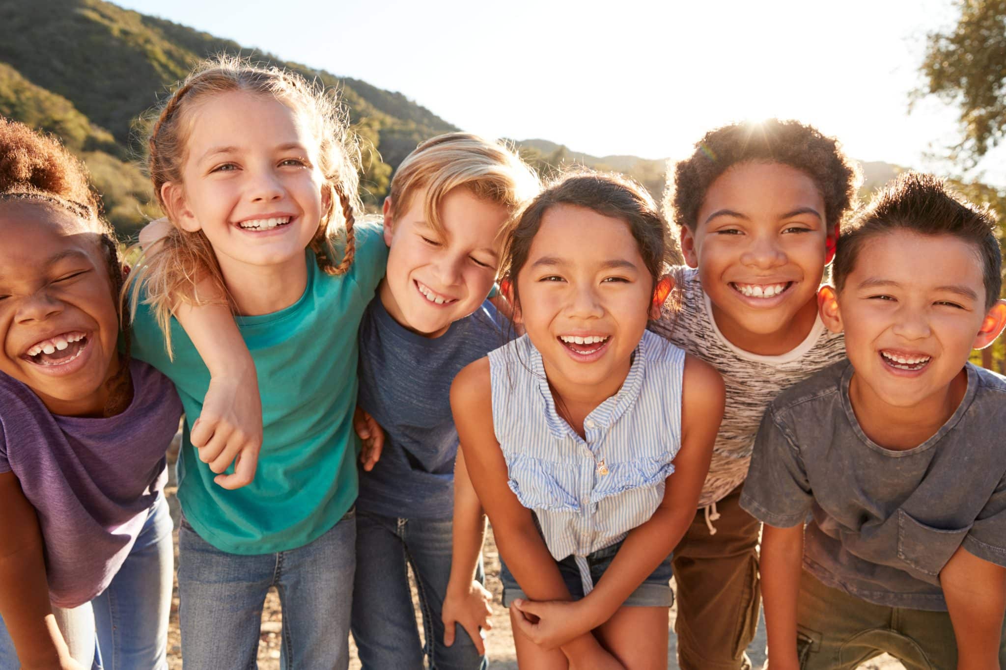 Portrait,Of,Multi-cultural,Children,Hanging,Out,With,Friends,In,The