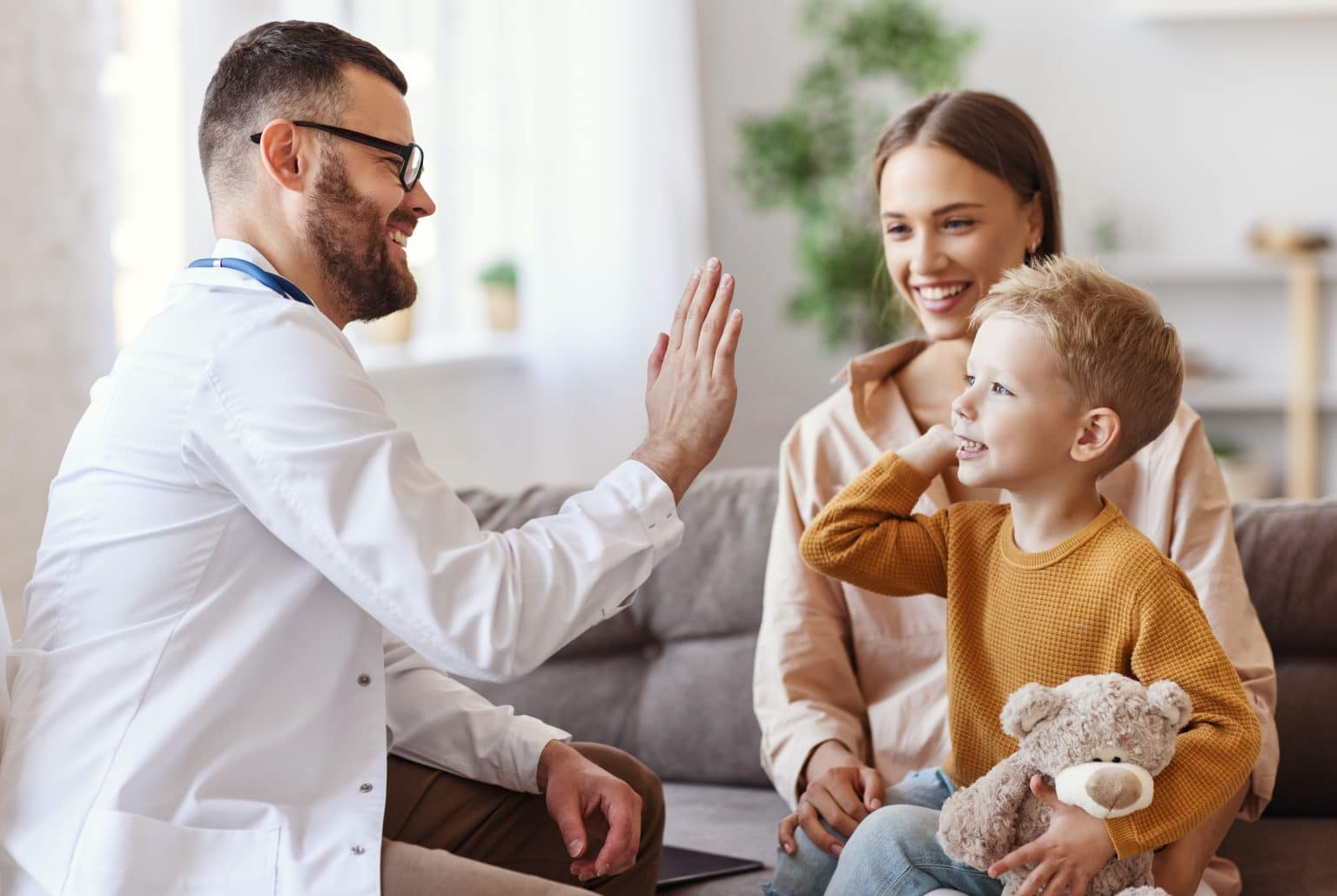 Child high five pediatrician