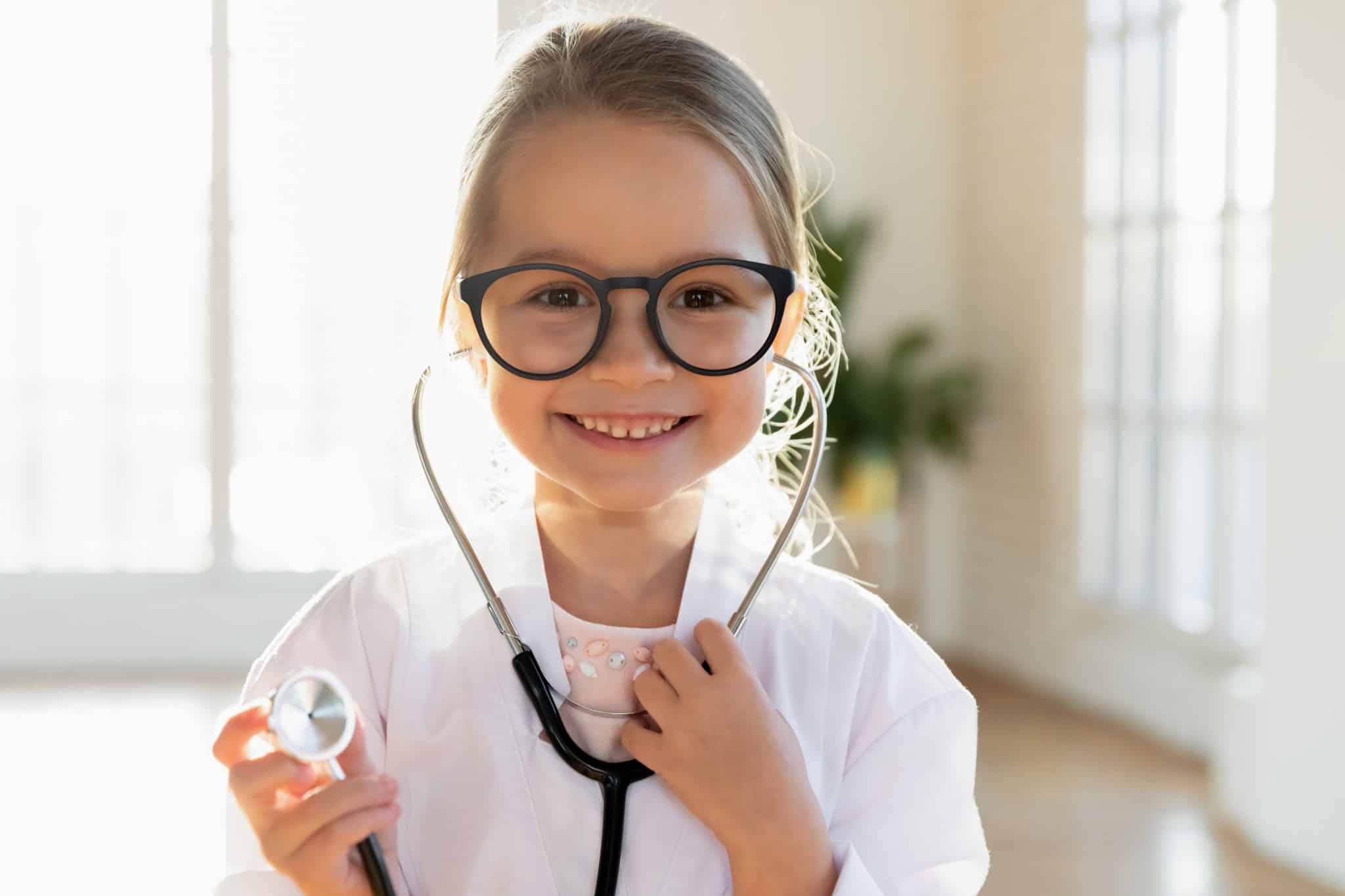 Girl with stethoscope and glasses