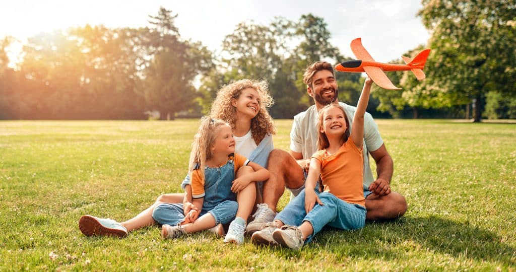 Happy,Young,Family,Dad,,Mom,And,Two,Children,Daughters,Playing